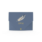 Heron Mahjong Card Wallet, Slate Blue: front with a feather and gold AWM monogram