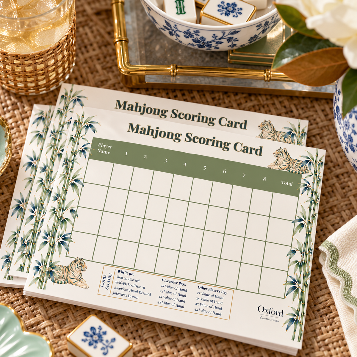Mahjong scorecard notepads for coins stacked on a game table, Tigers & Bamboo design