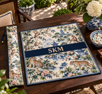 Mahjong mat dust bag, Tigers & Monkeys design, shown with a matching monogrammed mahjong mat on a wood table