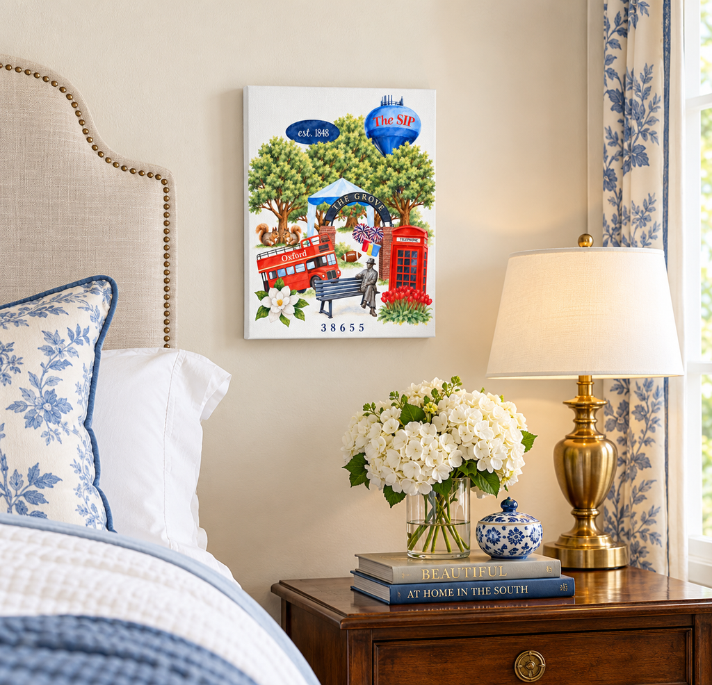 A Love Letter to Oxford canvas, 10 x 8 inch size, hanging above a nightstand in a blue and white bedroom