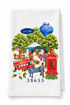 A Love Letter to Oxford tea towel laid flat, showing the Grove arch, The SIP water tower, red bus, phone booth and 38655